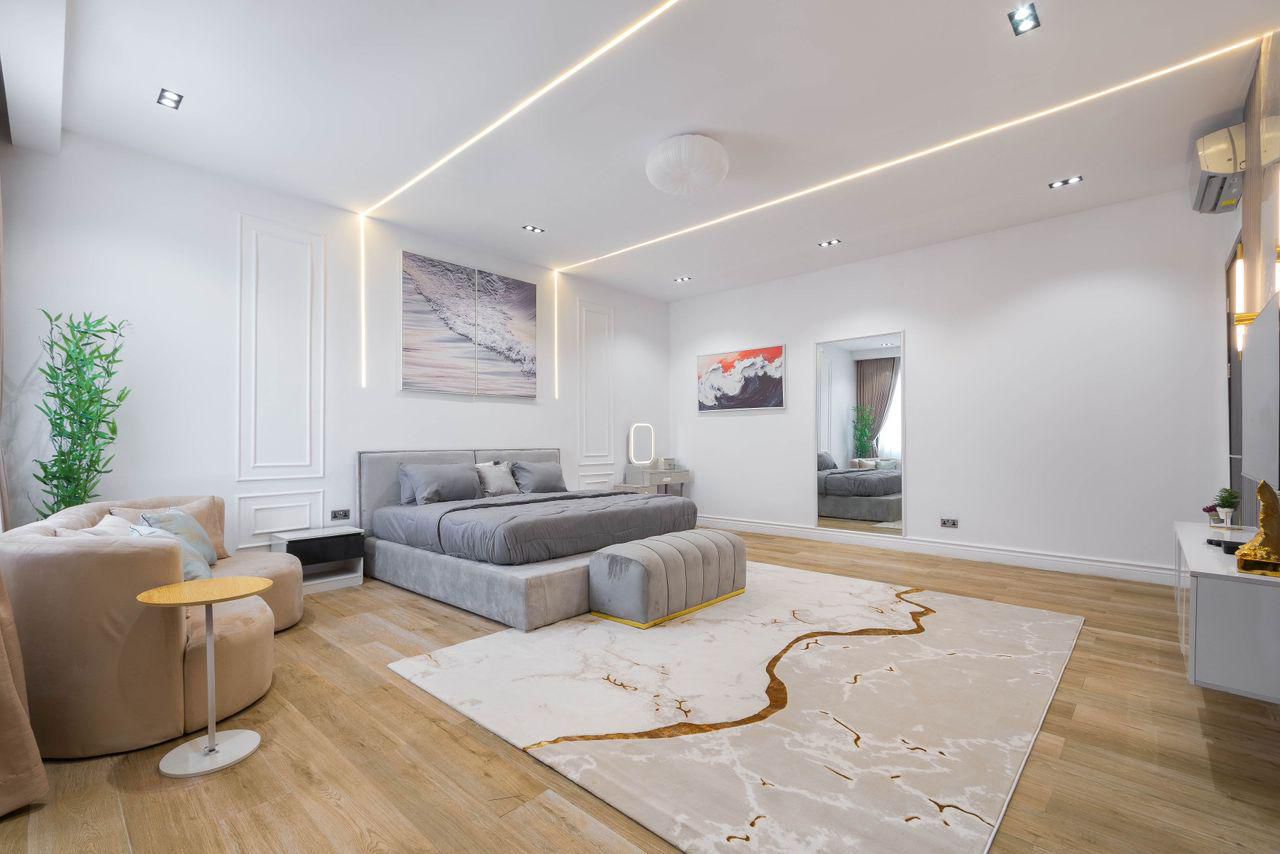 Master Suite with Linear LED Ceiling and Wainscoting