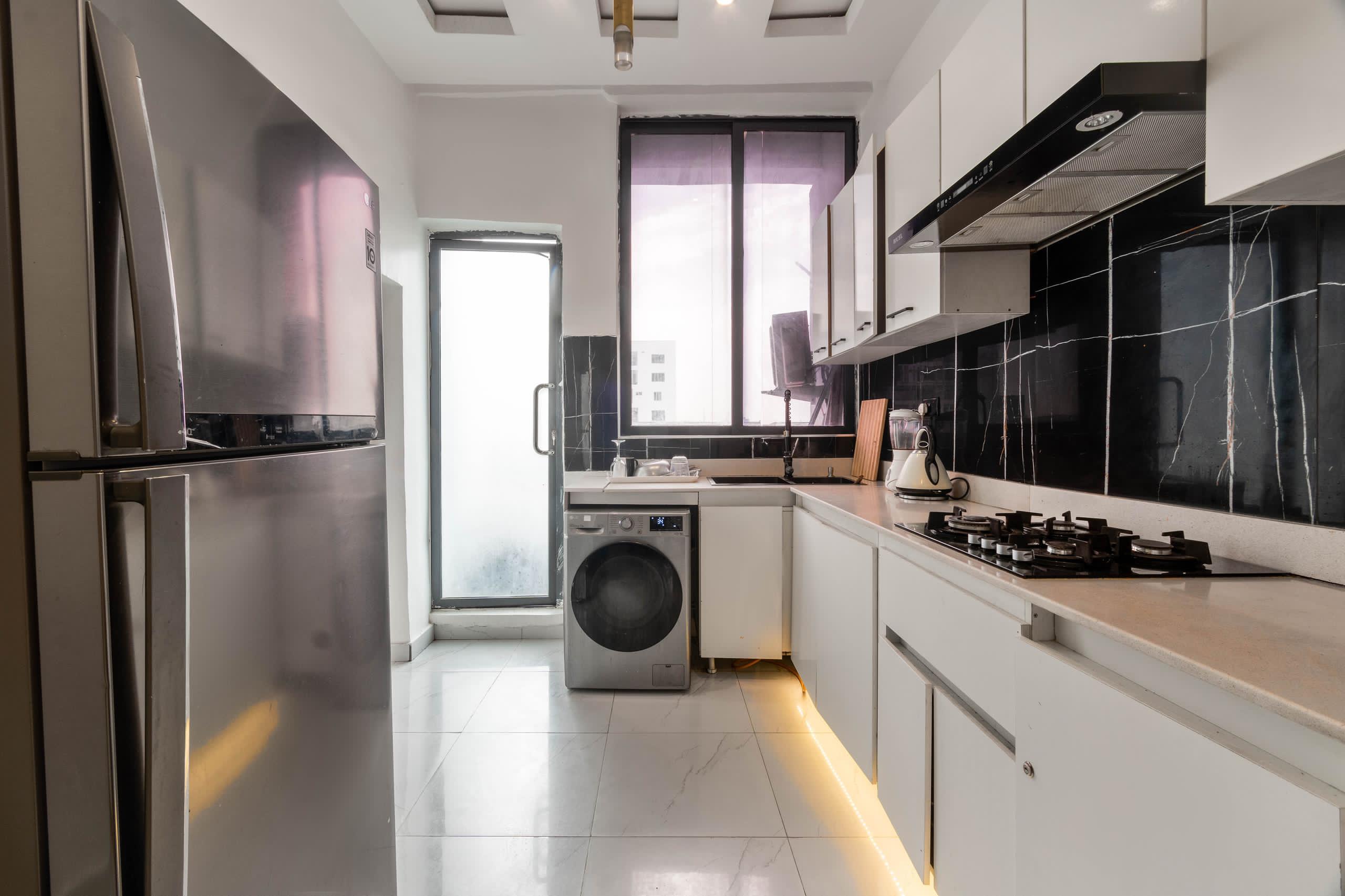 Tuxedo Kitchen with Black Marble Backsplash