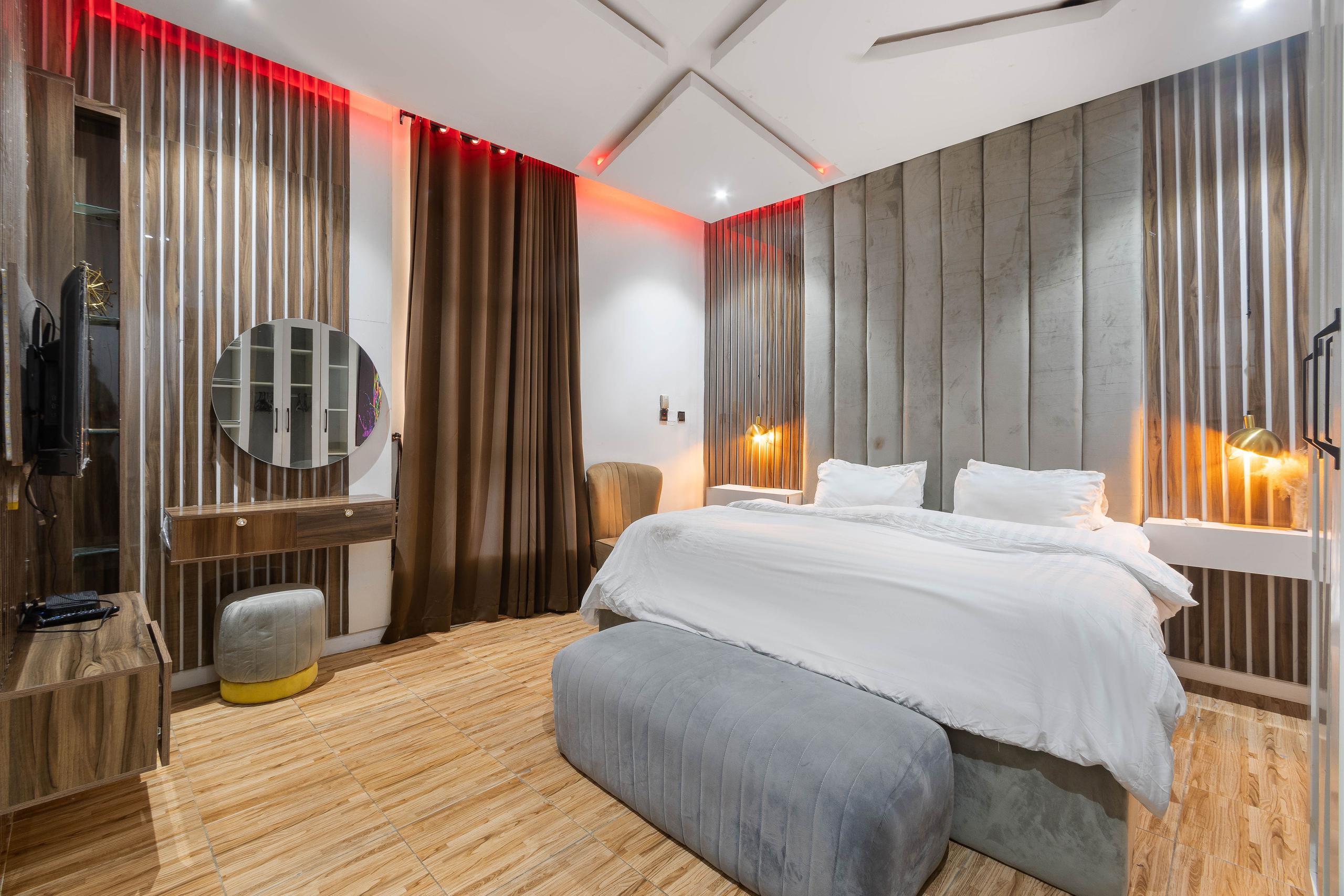 Master Bedroom with Channeled Velvet Headboard