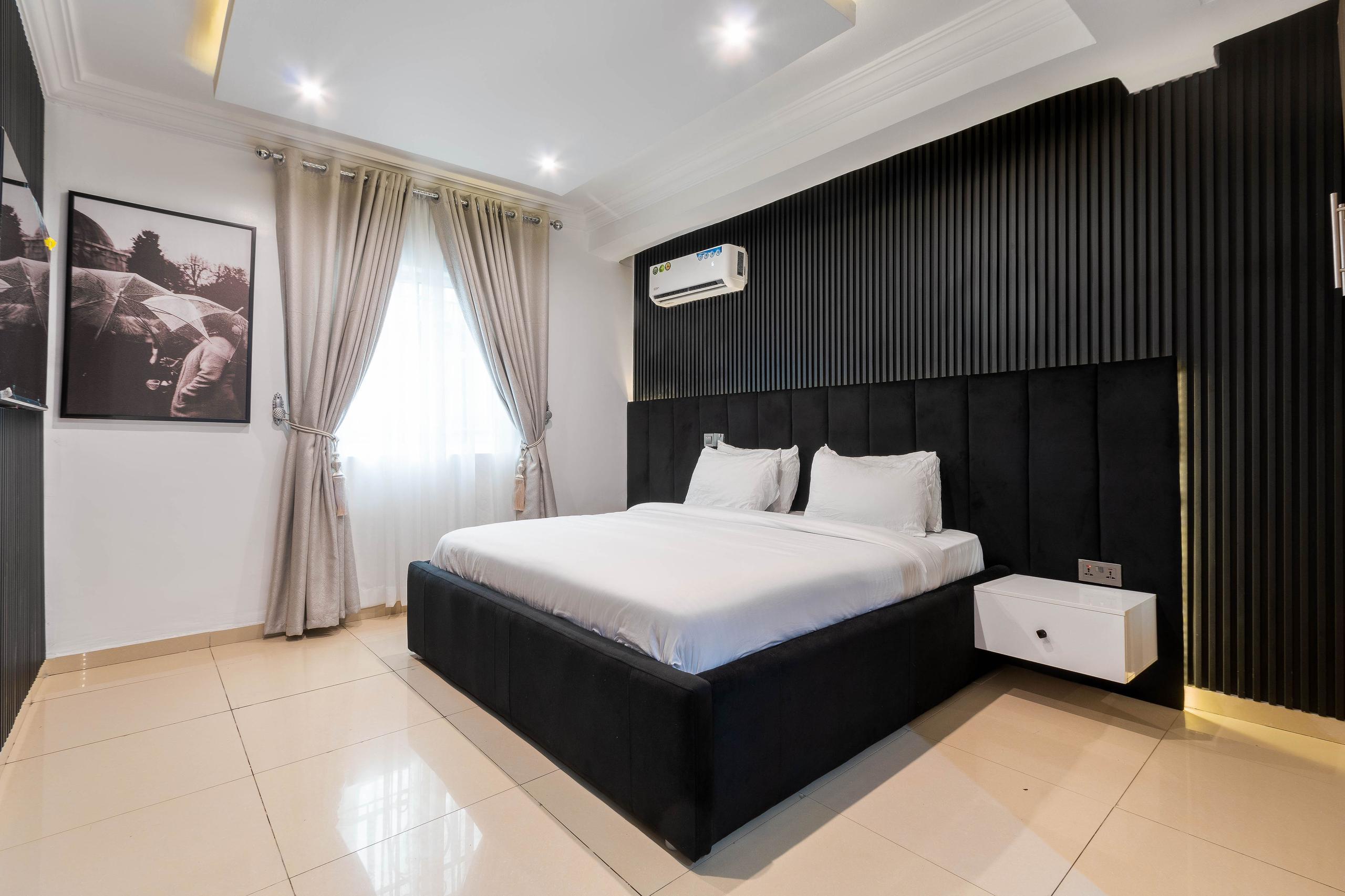 Bedroom with Oversized Black Fluted Panel