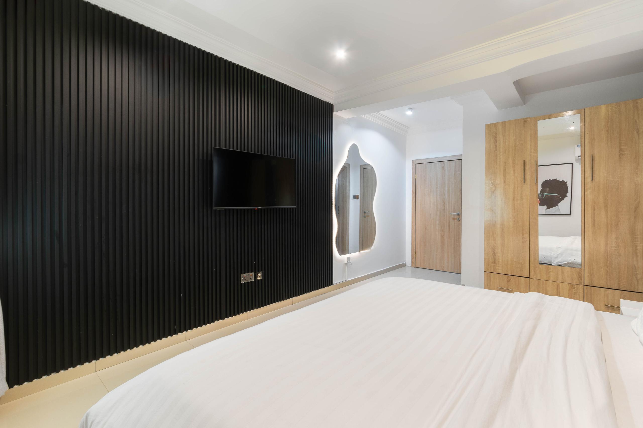 Bedroom with Backlit Organic Mirror