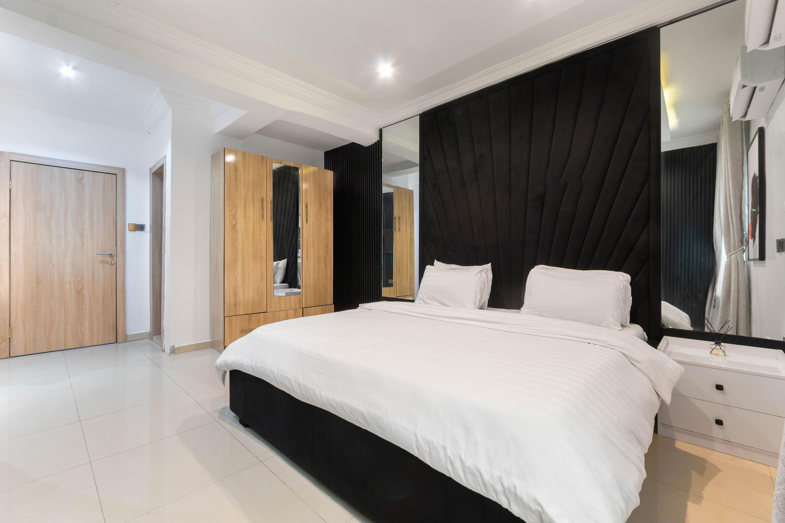 Master Bedroom with Fan-Shaped Black Headboard