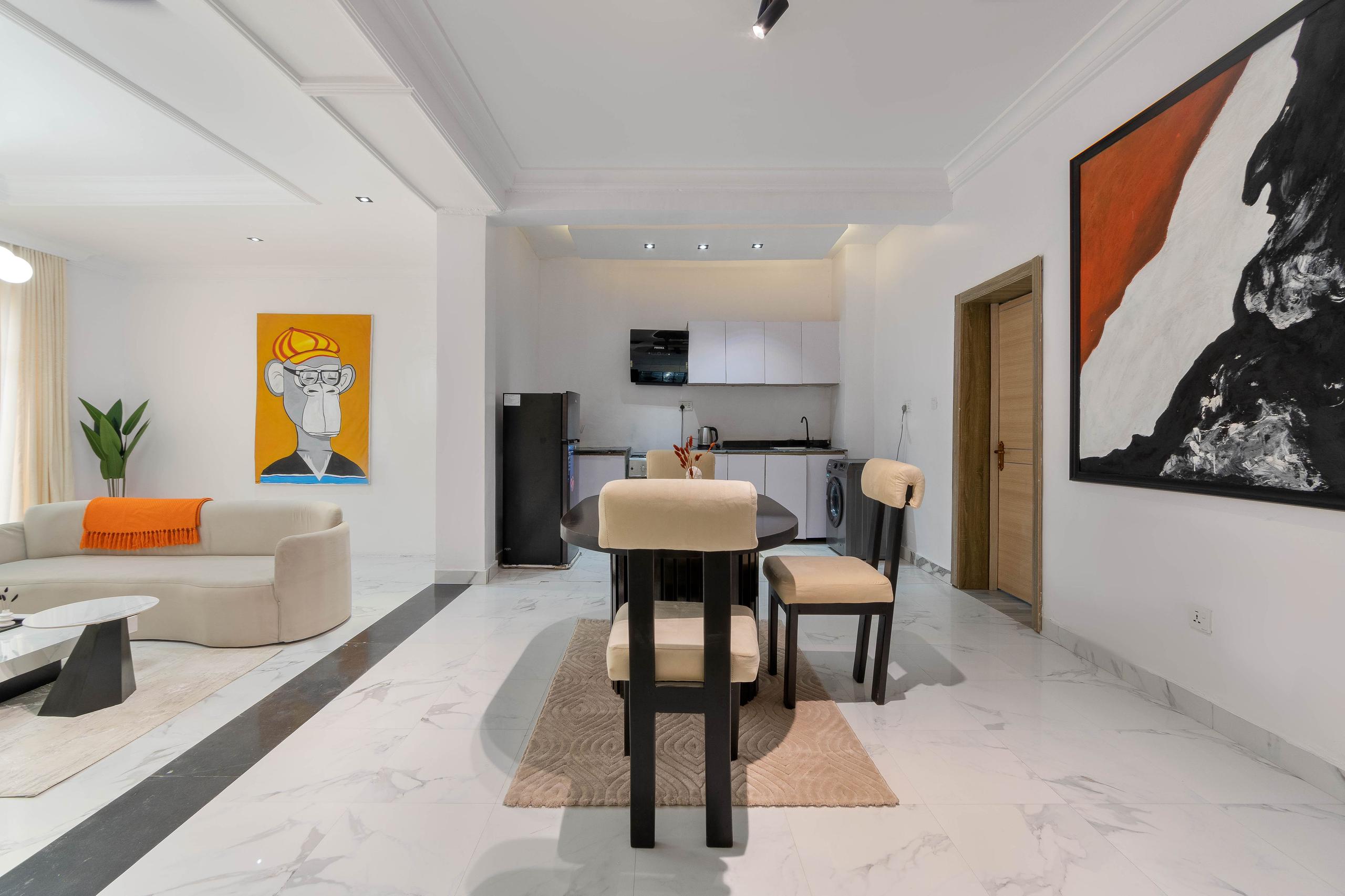 Dining Area with Pop-Art Portrait and Kitchenette